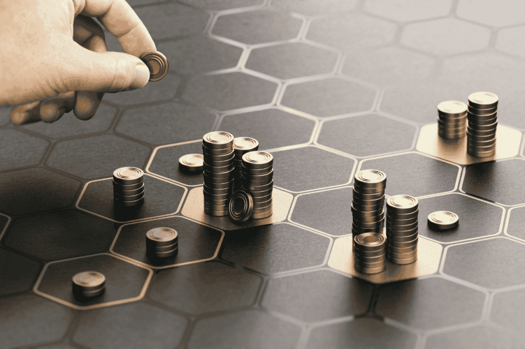 Hand placing coins on a financial planning chart